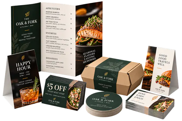 Menus, table tents, takeout materials, and coupons arranged on a studio surface.